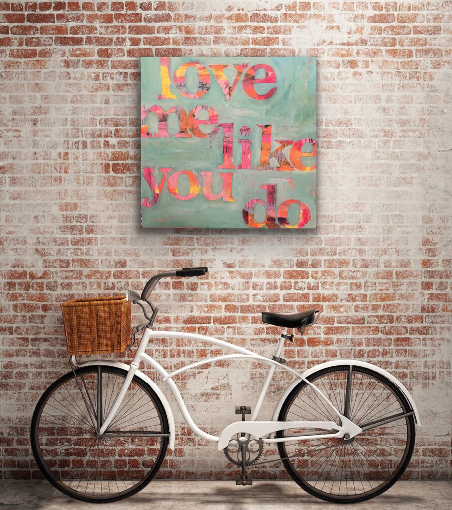 words to live by large canvas "love me like you do" with a bicycle